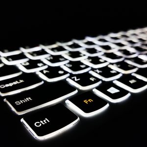 keyboard-with-white-backlight-keyboard-on-black-background-modern-technology-keyboard-key-illumination